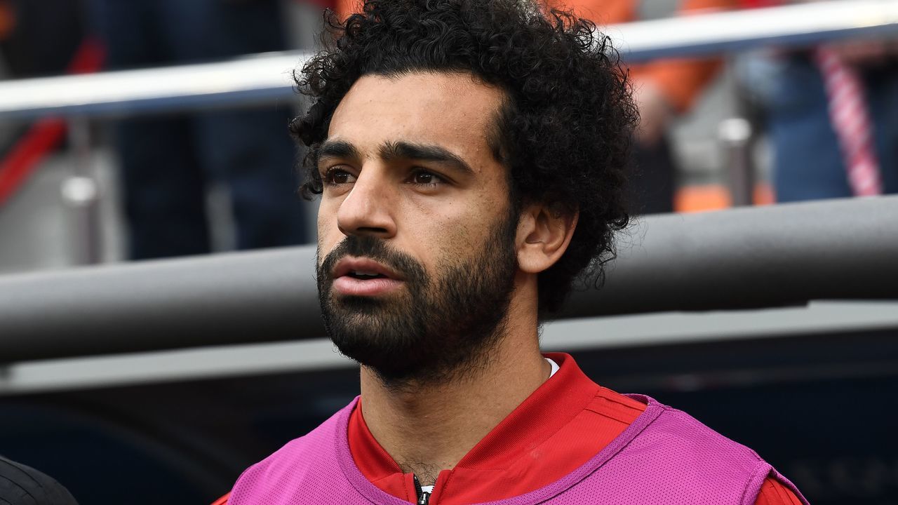 TOPSHOT - Egypt's forward Mohamed Salah is seen by the substitutes bench before kick off of the Russia 2018 World Cup Group A football match between Egypt and Uruguay at the Ekaterinburg Arena in Ekaterinburg on June 15, 2018.
