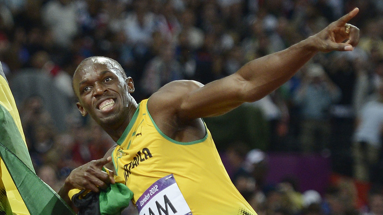 Jamaica's Usain Bolt celebrates after Jamaica won and set a new world record in the men's 4X100 relay final at the athletics event of the London 2012 Olympic Games on August 11, 2012 in London. AFP PHOTO / ADRIAN DENNIS