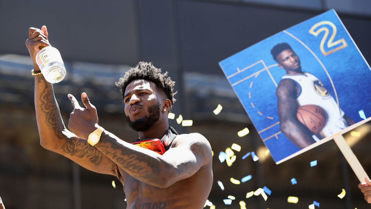 OAKLAND, CA - JUNE 12: Jordan Bell #2 of the Golden State Warriors rides on a bus during the Golden State Warriors Victory Parade on June 12, 2018 in Oakland, California. The Golden State Warriors beat the Cleveland Cavaliers 4-0 to win the 2018 NBA Finals.