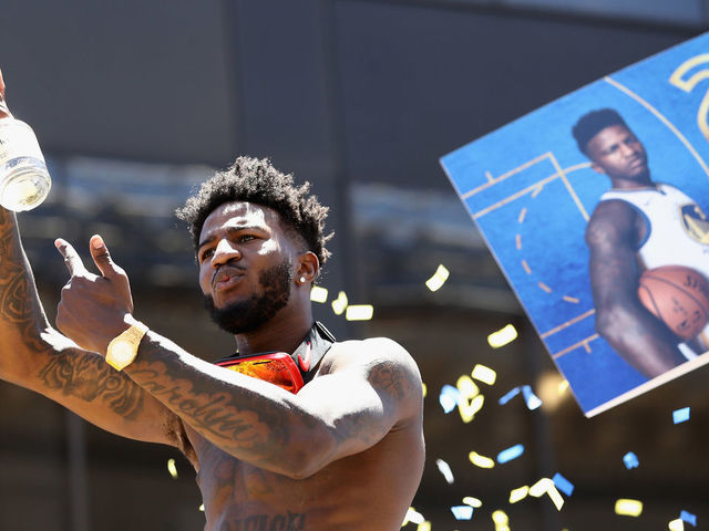 OAKLAND, CA - JUNE 12: Jordan Bell #2 of the Golden State Warriors rides on a bus during the Golden State Warriors Victory Parade on June 12, 2018 in Oakland, California. The Golden State Warriors beat the Cleveland Cavaliers 4-0 to win the 2018 NBA Finals.