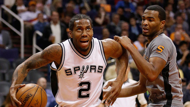 PHOENIX, AZ - JANUARY 21: Kawhi Leonard #2 of the San Antonio Spurs handles the ball during the NBA game against the Phoenix Suns at Talking Stick Resort Arena on January 21, 2016 in Phoenix, Arizona. The Spurs defeated the Suns 117-89.