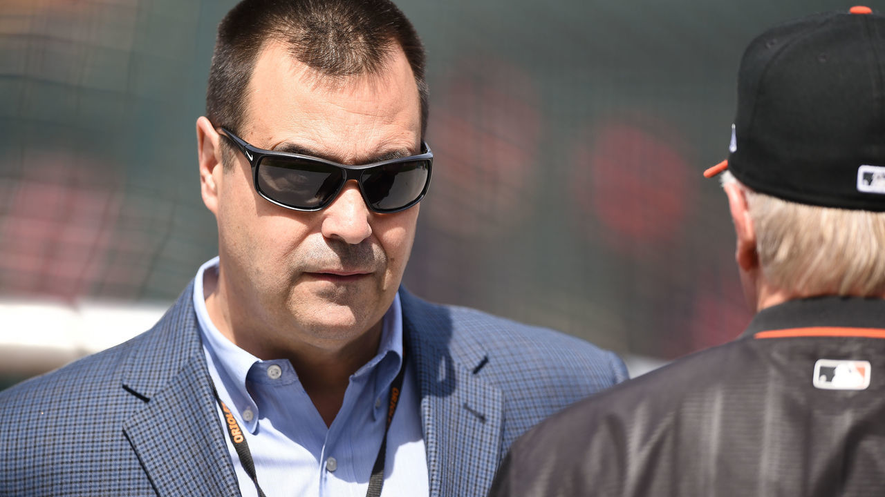 BALTIMORE, MD - APRIL 21: General manager Dan Duquette of the Baltimore Orioles talks with manager Buck Showalter #26 before a baseball game against the Cleveland Indians at Oriole Park at Camden Yards on April 21, 2018 in Baltimore, Maryland.