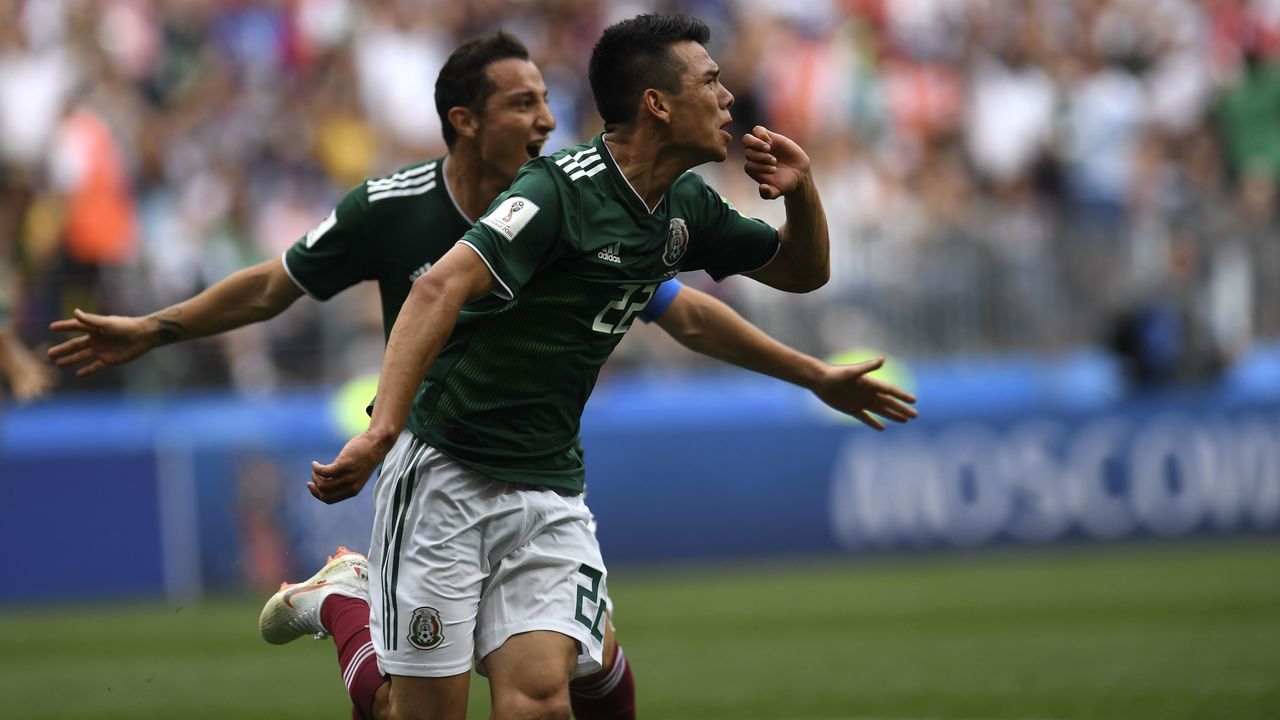 Mexico's forward Hirving Lozano (C) celebrates after scoring a goal during the Russia 2018 World Cup Group F football match between Germany and Mexico at the Luzhniki Stadium in Moscow on June 17, 2018.