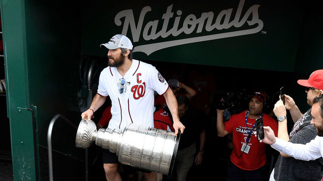 WASHINGTON, DC - JUNE 09: Alex Ovechkin of the Washington Capitals carries the Stanley Cup onto the field before the game between the Washington Nationals and the San Francisco Giants at Nationals Park on June 9, 2018 in Washington, DC.