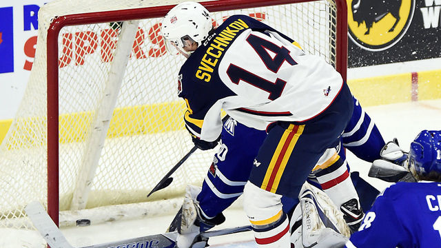 MISSISSAUGA, ON - JANUARY 19: Andrei Svechnikov #14 of the Barrie Colts fires the puck past goalie Emanuel Vella #30 of the Mississauga Steelheads during game action on January 19, 2018 at Hershey Centre in Mississauga, Ontario, Canada.