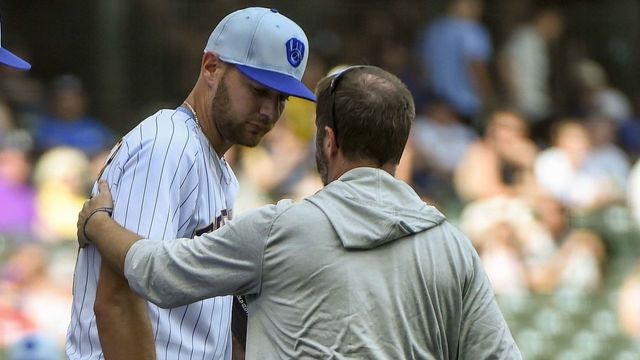 Brewers' Houser remains in game despite puking on mound twice