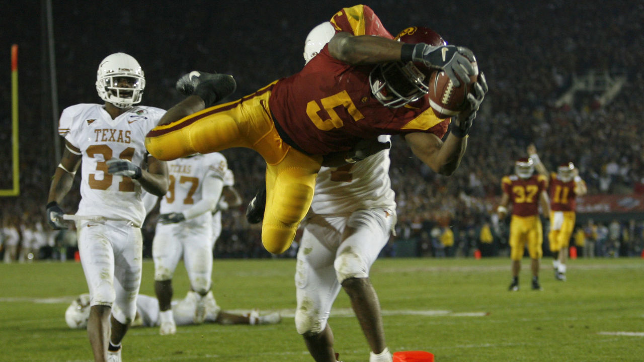 USC's Reggie Bush goes upside down to score a touch down in the fourth quarter against the Texas Longhorns for the national championship at the Rose Bowl Game in Pasadena, Wednesday, Jan. 4, 2006.