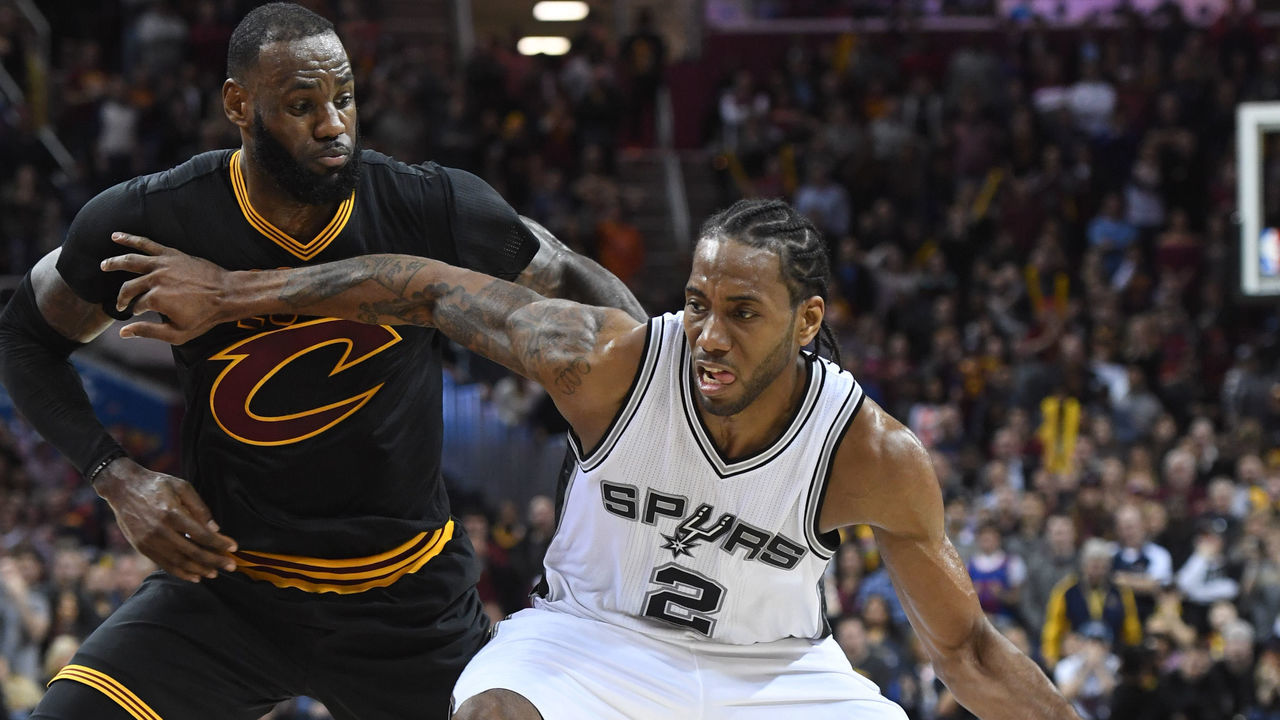 CLEVELAND, OH - JANUARY 21: Kawhi Leonard #2 of the San Antonio Spurs drives past LeBron James #23 of the Cleveland Cavaliers during the second half at Quicken Loans Arena on January 21, 2017 in Cleveland, Ohio. The Spurs defeated the Cavaliers 118-115. NOTE TO USER: User expressly acknowledges and agrees that, by downloading and/or using this photograph, user is consenting to the terms and conditions of the Getty Images License Agreement. Mandatory copyright notice.
