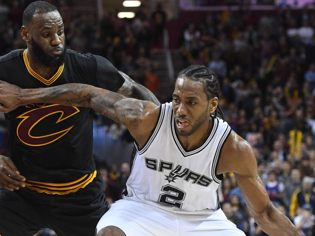 CLEVELAND, OH - JANUARY 21: Kawhi Leonard #2 of the San Antonio Spurs drives past LeBron James #23 of the Cleveland Cavaliers during the second half at Quicken Loans Arena on January 21, 2017 in Cleveland, Ohio. The Spurs defeated the Cavaliers 118-115. NOTE TO USER: User expressly acknowledges and agrees that, by downloading and/or using this photograph, user is consenting to the terms and conditions of the Getty Images License Agreement. Mandatory copyright notice.