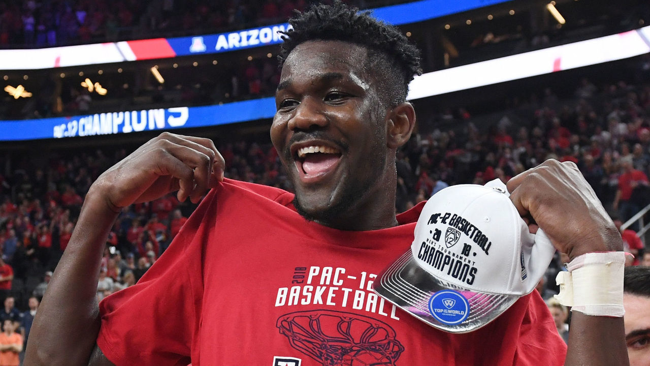 LAS VEGAS, NV - MARCH 10: Deandre Ayton #13 of the Arizona Wildcats celebrates after the team defeated the USC Trojans 75-61 to win the championship game of the Pac-12 basketball tournament at T-Mobile Arena on March 10, 2018 in Las Vegas, Nevada.