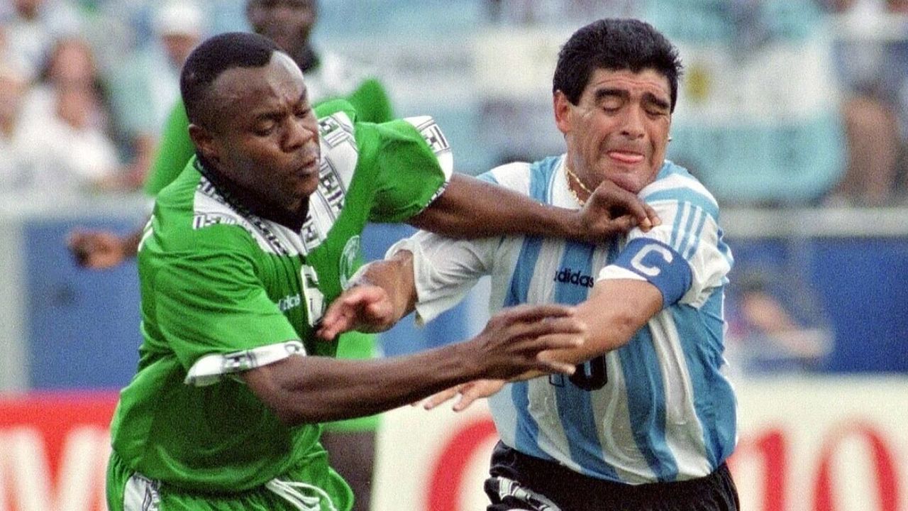 Argentina soccer team captain Diego Maradona (R) tries to get past Nigerian defender Chidi Nwanu during the World Cup game 25 June at Foxboro Stadium near Boston. Argentina won 2-1 and is already qualified for the second round.
