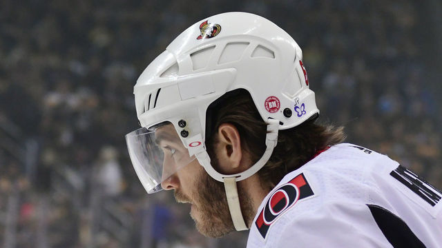 PITTSBURGH, PA - APRIL 06: Mike Hoffman #68 of the Ottawa Senators displays a butterfly sticker on his helmet during a game against the Pittsburgh Penguins at PPG PAINTS Arena on April 6, 2018 in Pittsburgh, Pennsylvania. The butterfly is being worn by all players tonight in Pittsburgh as a tribute to Jonathan Pitre who passed away the day before yesterday.