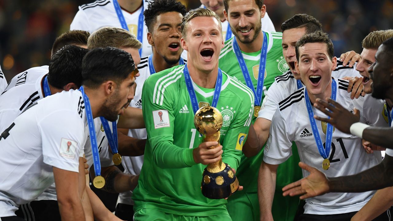 Germany's goalkeeper Bernd Leno holds the trophy after they beat Chile 1-0 in the 2017 Confederations Cup final football match between Chile and Germany at the Saint Petersburg Stadium in Saint Petersburg on July 2, 2017. / AFP PHOTO / FRANCK FIFE