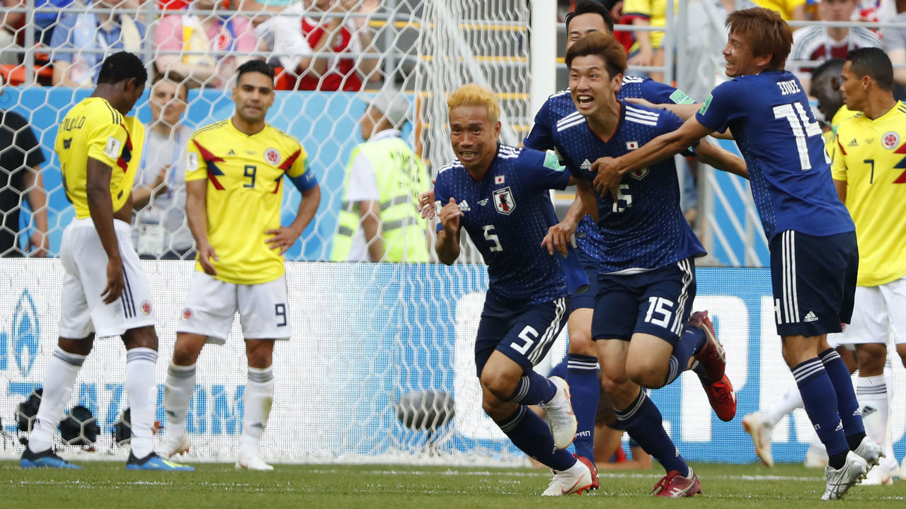 Japan's forward Yuya Osako (2ndR) celebrates with teammates after scoring a goal during the Russia 2018 World Cup Group H football match between Colombia and Japan at the Mordovia Arena in Saransk on June 19, 2018.