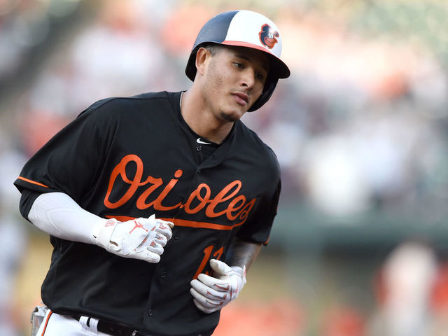 BALTIMORE, MD - JUNE 01: Manny Machado #13 of the Baltimore Orioles rounds the bases after hitting a home run during a baseball game against the New York Yankees at Oriole Park at Camden Yards on June 1, 2018 in Baltimore, Maryland.