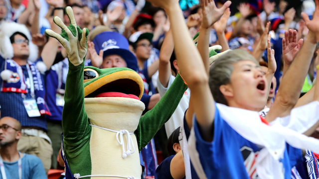 SARANSK, RUSSIA - JUNE 19: A Japan fan in a frog outfit watches the 2018 FIFA World Cup Russia group H match between Colombia and Japan at Mordovia Arena on June 19, 2018 in Saransk, Russia.