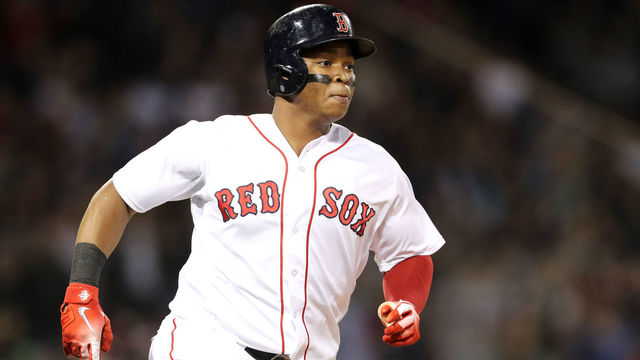 BOSTON, MA - MAY 1: Rafael Devers #11 of the Boston Red Sox runs towards first after hitting a double against the Kansas City Royalsduring the sixth inning at Fenway Park on May 1, 2018 in Boston, Massachusetts.
