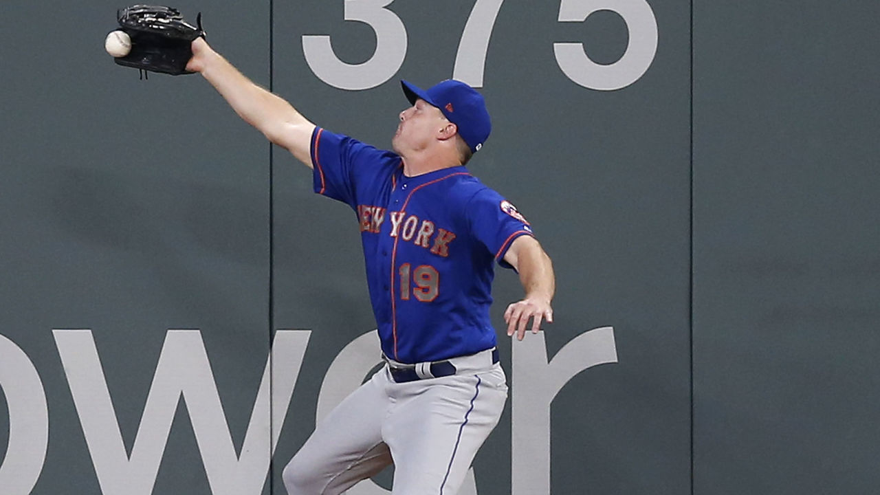 ATLANTA, GA - JUNE 12: Right fielder Jay Bruce #19 of the New York Mets jumps and stretches but does not catch a double hit by right fielder Nick Markakis #22 of the Atlanta Braves (not pictured) during the game at SunTrust Park on June 12, 2018 in Atlanta, Georgia.
