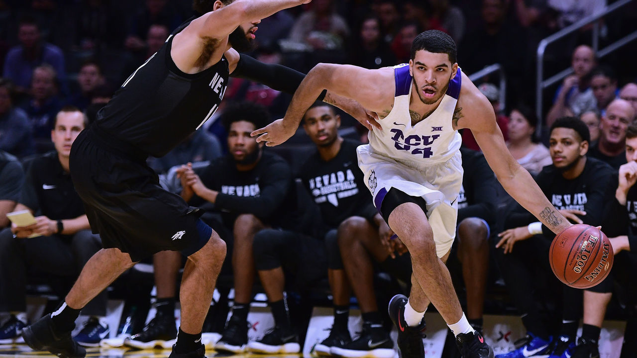LOS ANGELES, CA - DECEMBER 08: Kenrich Williams #34 of the TCU Horned Frogs drives on Cody Martin #11 of the Nevada Wolf Pack during the Basketball Hall of Fame Classic at Staples Center on December 8, 2017 in Los Angeles, California.