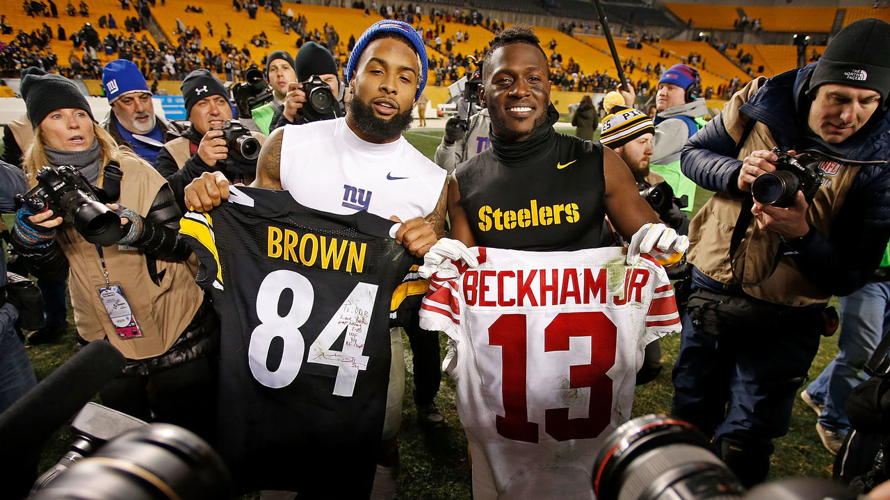 PITTSBURGH, PA - DECEMBER 04: Antonio Brown #84 of the Pittsburgh Steelers and Odell Beckham #13 of the New York Giants pose with jerseys they exchanged with each other at the conclusion of the Pittsburgh Steelers 24-14 win over the New York Giants at Heinz Field on December 4, 2016 in Pittsburgh, Pennsylvania.