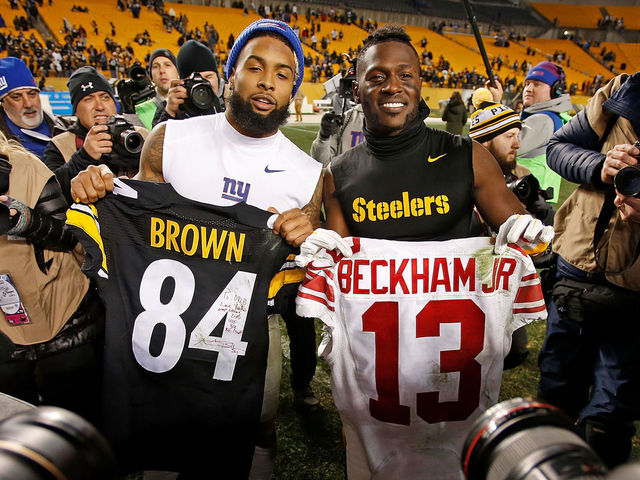 PITTSBURGH, PA - DECEMBER 04: Antonio Brown #84 of the Pittsburgh Steelers and Odell Beckham #13 of the New York Giants pose with jerseys they exchanged with each other at the conclusion of the Pittsburgh Steelers 24-14 win over the New York Giants at Heinz Field on December 4, 2016 in Pittsburgh, Pennsylvania.