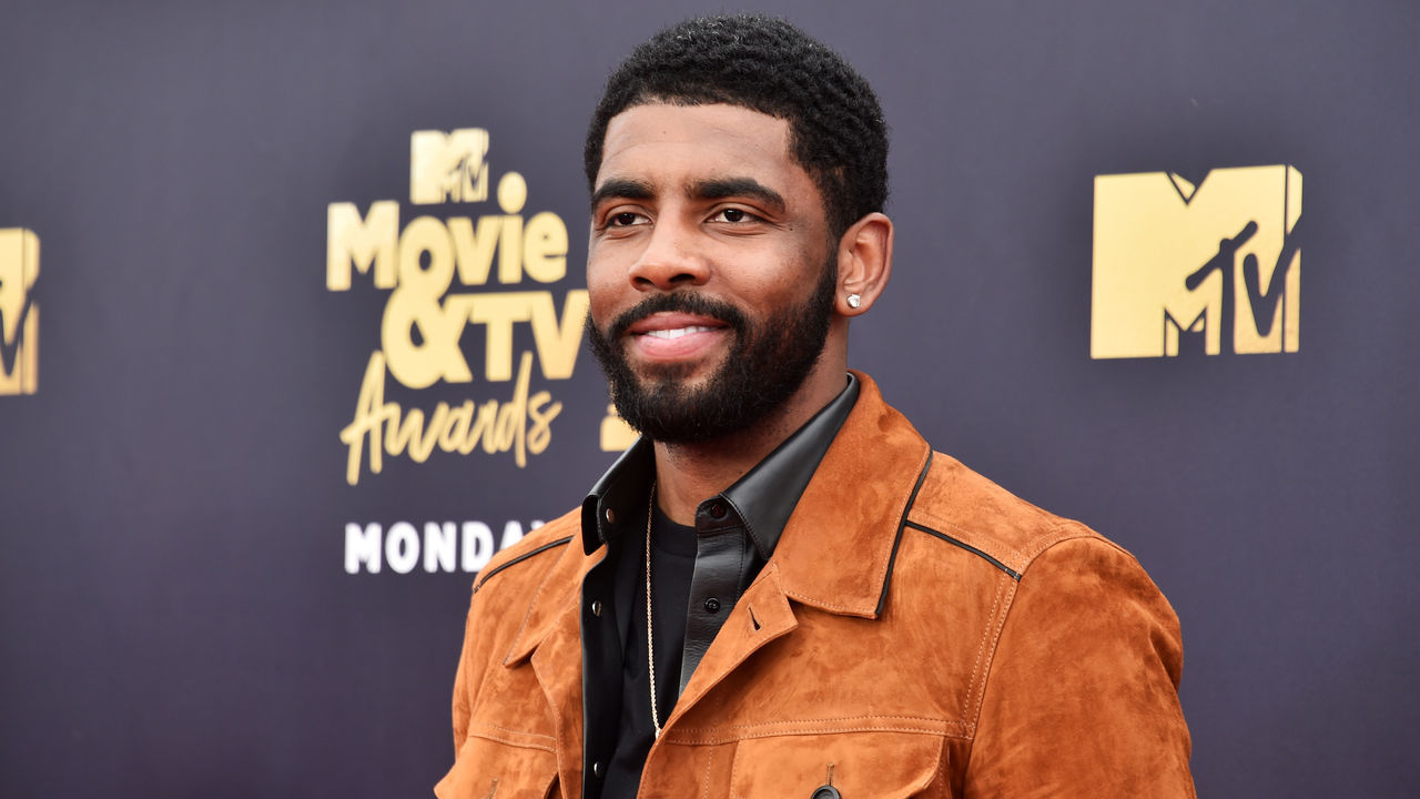 SANTA MONICA, CA - JUNE 16: Basketball player Kyrie Irving attends the 2018 MTV Movie And TV Awards at Barker Hangar on June 16, 2018 in Santa Monica, California.