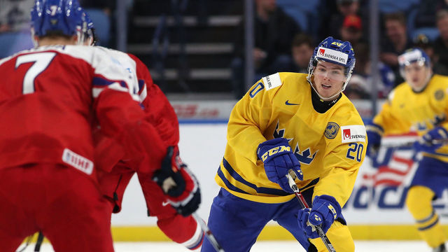BUFFALO, NY - DECEMBER 28: Isac Lundestrom #20 of Sweden skates up ice with the puck in the third period against Czech Republic during the IIHF World Junior Championship at KeyBank Center on December 28, 2017 in Buffalo, New York. Sweden beat Czech Republic 3-1.