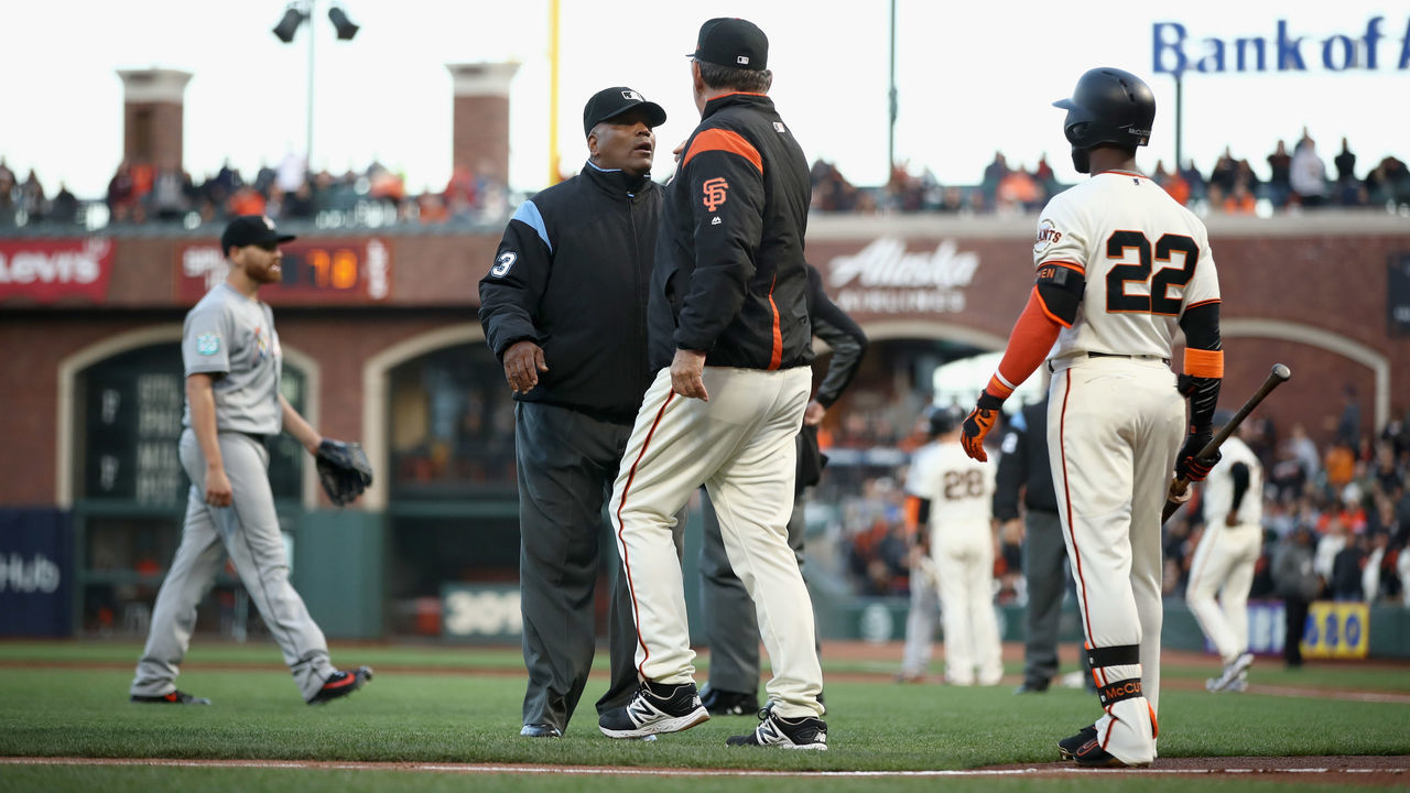 SAN FRANCISCO, CA - JUNE 19: Manager Bruce Bochy of the San Francisco Giants argues with umpire Laz Diaz after Dan Straily #58 of the Miami Marlins hit Buster Posey #28 of the San Francisco Giants in the second inning at AT&T Park on June 19, 2018 in San Francisco, California.