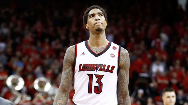 LOUISVILLE, KY - MARCH 01: Ray Spalding #13 of the Louisville Cardinals walks off of the court after a three point basket at the buzzer by De'Andre Hunter #12 of the Virginia Cavaliers beat the Cardinals 67-66 at KFC YUM! Center on March 1, 2018 in Louisville, Kentucky.