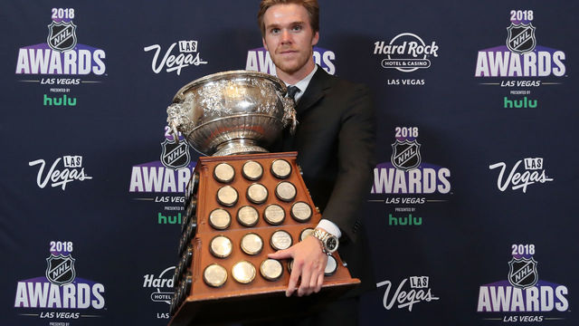 LAS VEGAS, NV - JUNE 20: Connor McDavid of the Edmonton Oilers poses with the Art Ross Trophy as the NHL's leading scorer in the press room at the 2018 NHL Awards presented by Hulu at the Hard Rock Hotel & Casino on June 20, 2018 in Las Vegas, Nevada.