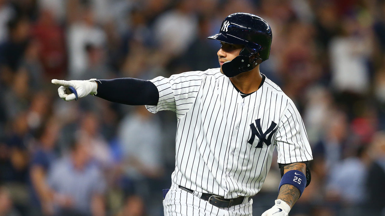 NEW YORK, NY - JUNE 14: Gleyber Torres #25 of the New York Yankees points to the dugout after hitting a 3-run home run in the fifth inning against the Tampa Bay Rays at Yankee Stadium on June 14, 2018 in the Bronx borough of New York City.