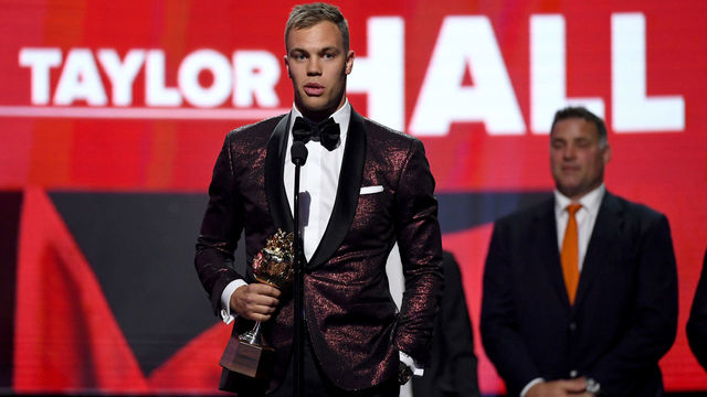 LAS VEGAS, NV - JUNE 20: Taylor Hall of the New Jersey Devils accepts the Hart Trophy given to the most valuable player to his team onstage at the 2018 NHL Awards presented by Hulu at The Joint inside the Hard Rock Hotel & Casino on June 20, 2018 in Las Vegas, Nevada.