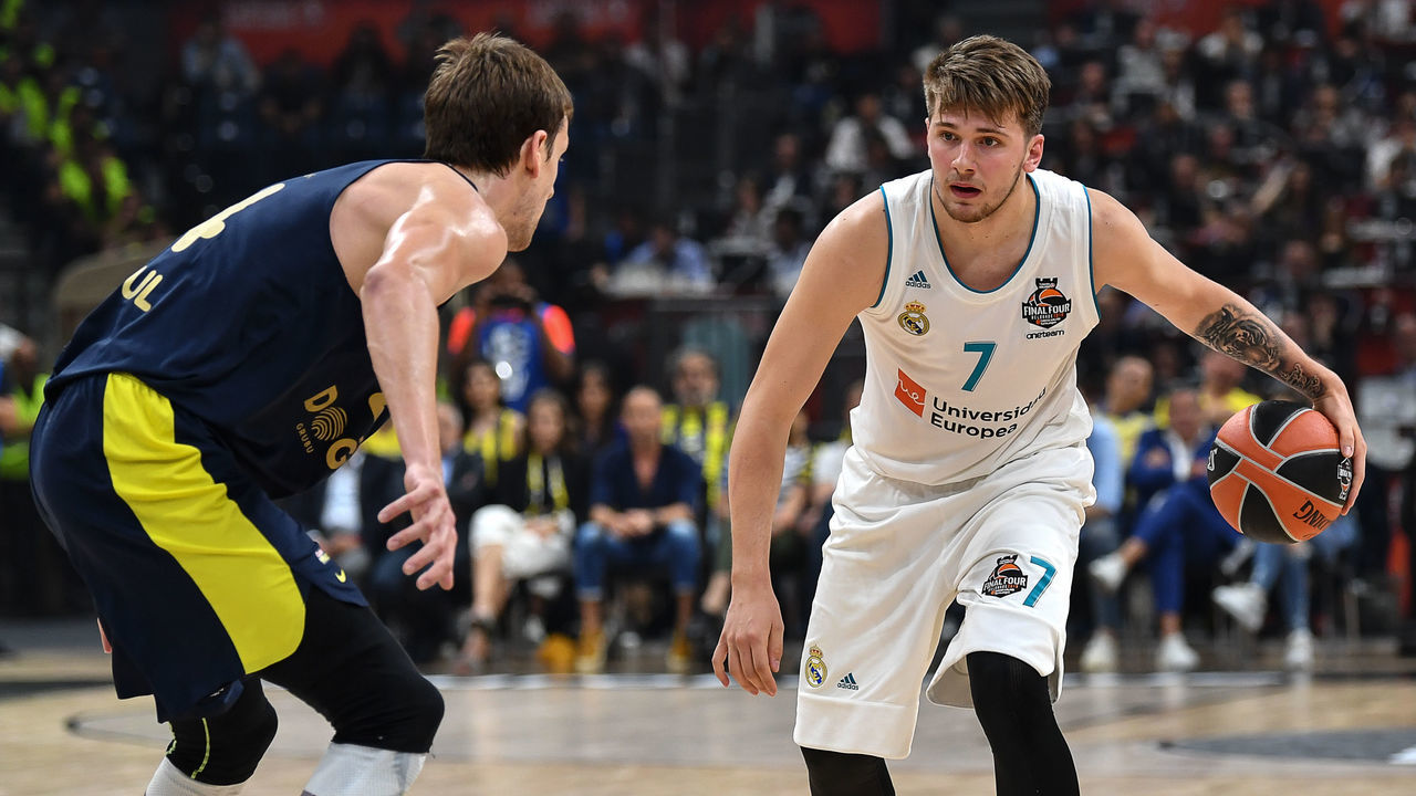 Fenerbahce's Czech center Jan Vesely (L) fights for the ball against Real Madrid's Slovenian Luka Doncic during the Euroleague Final Four finals basketball match between Real Madrid and Fenerbahce Dogus Istanbul at The Stark Arena in Belgrade on May 20, 2018.
