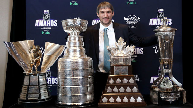 LAS VEGAS, NV - JUNE 20: Alex Ovechkin of the Washington Capitals poses with the the Maurice 'Rocket' Richard Trophy, the Stanley Cup, the Conn Smythe Trophy and the Prince of Wales Trophy in the press room at the 2018 NHL Awards presented by Hulu at the Hard Rock Hotel & Casino on June 20, 2018 in Las Vegas, Nevada.
