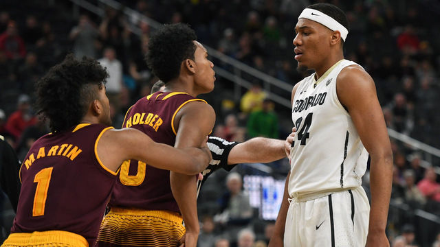 LAS VEGAS, NV - MARCH 07: Remy Martin #1 of the Arizona State Sun Devils holds back teammate Tra Holder #0 as a referee moves in to separate him from George King #24 of the Colorado Buffaloes late in a first-round game of the Pac-12 basketball tournament at T-Mobile Arena on March 7, 2018 in Las Vegas, Nevada. The Buffaloes won 97-85.