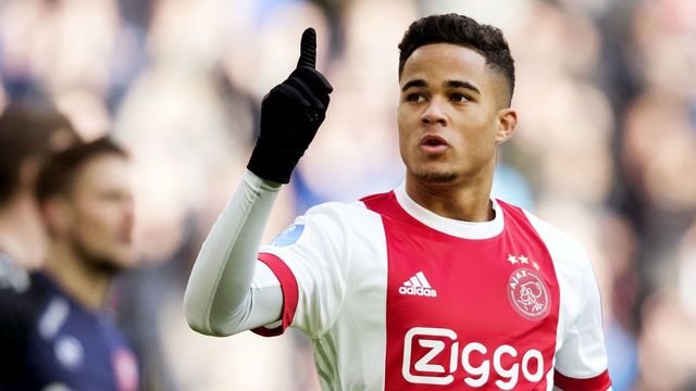 Ajax Amsterdam's midfielder Justin Kluivert reacts after opening the scoring during the Dutch Eredivisie soccer match between Ajax Amsterdam and FC Twente Enschede, in Amsterdam on February 11, 2018. / AFP PHOTO / ANP / Olaf KRAAK / Netherlands OUT