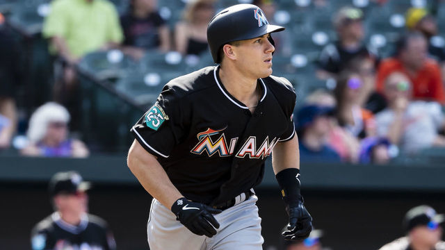 BALTIMORE, MD - JUNE 16: J.T. Realmuto #11 of the Miami Marlins hits a two-run homerun during the third inning at Oriole Park at Camden Yards on June 16, 2018 in Baltimore, Maryland.
