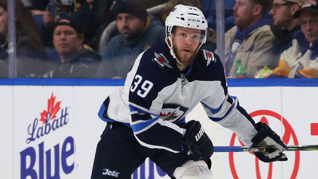 BUFFALO, NY - JANUARY 9: Toby Enstrom #39 of the Winnipeg Jets in play against the Buffalo Sabres at the KeyBank Center on January 9, 2018 in Buffalo, New York. The Jets beat the Sabres 7-4.