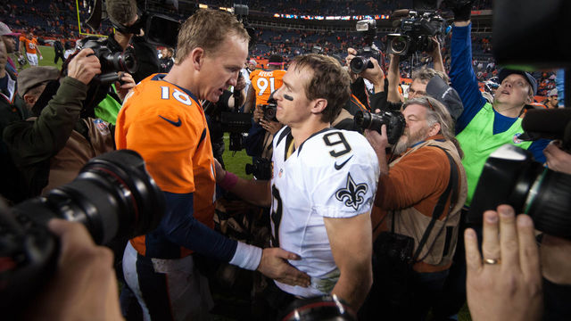DENVER, CO - OCTOBER 28: Quarterback Drew Brees #9 of the New Orleans Saints congratulates quarterback Peyton Manning #18 of the Denver Broncos after a game at Sports Authority Field Field at Mile High on October 28, 2012 in Denver, Colorado.