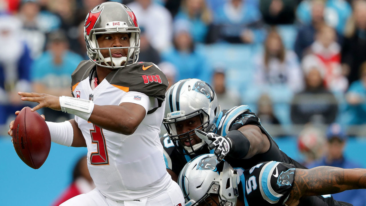 CHARLOTTE, NC - DECEMBER 24: Jameis Winston #3 of the Tampa Bay Buccaneers runs with the ball against the Carolina Panthers during their game at Bank of America Stadium on December 24, 2017 in Charlotte, North Carolina.