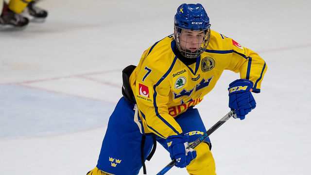 PLYMOUTH, MI - FEBRUARY 15: Nils Lundkvist #7 of the Sweden Nationals turns up ice with the puck against the Finland Nationals during the 2018 Under-18 Five Nations Tournament game at USA Hockey Arena on February 15, 2018 in Plymouth, Michigan. Finland defeated Sweden 5-3. *** Local Caption *** Nils Lundkvist