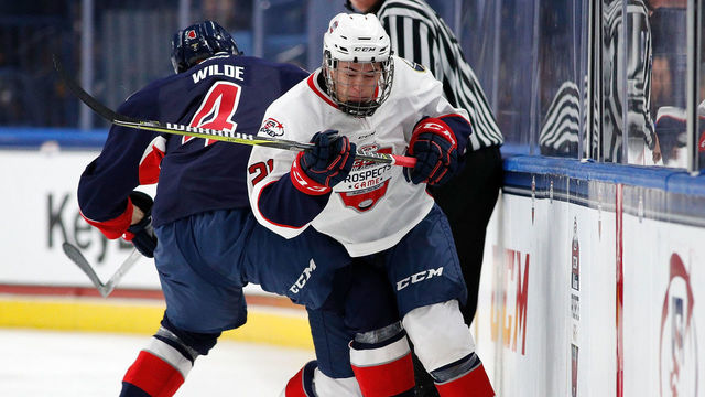 BUFFALO, NY - SEPTEMBER 21: Bode Wilde #4 of Team Leetch checks Jay O'Brien #21 of Team Chelios in the third period during the CCM/USA Hockey All-American Prospects Game at the KeyBank Center on September 21, 2017 in Buffalo, New York. Team Leetch beat Team Chelios 6-5.