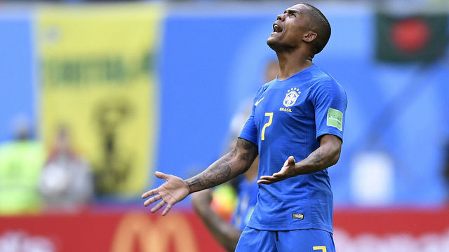 Brazil's forward Douglas Costa celebrates at the end of the Russia 2018 World Cup Group E football match between Brazil and Costa Rica at the Saint Petersburg Stadium in Saint Petersburg on June 22, 2018.