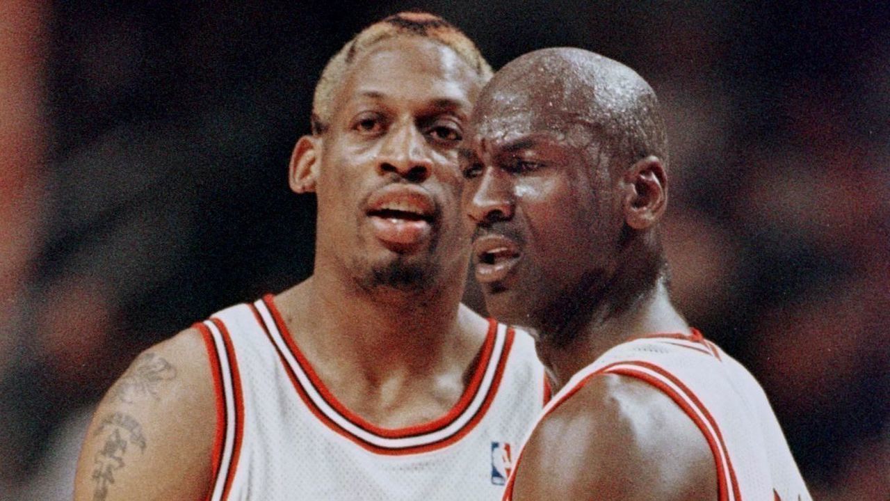 CHICAGO, UNITED STATES: Michael Jordan(R) of the Chicago Bulls pulls teammate Dennis Rodman away after Rodman was called for a technical foul 27 May during the first half of game five of the NBA Eastern Conference finals at the United Center in Chicago, Il. The series is tied 2-2. AFP PHOTO/Jeff HAYNES