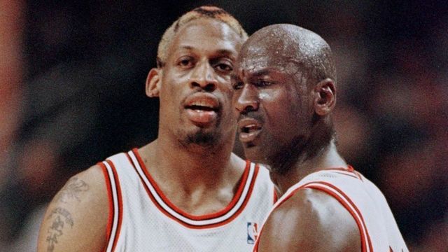 CHICAGO, UNITED STATES: Michael Jordan(R) of the Chicago Bulls pulls teammate Dennis Rodman away after Rodman was called for a technical foul 27 May during the first half of game five of the NBA Eastern Conference finals at the United Center in Chicago, Il. The series is tied 2-2. AFP PHOTO/Jeff HAYNES