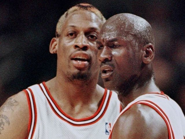 CHICAGO, UNITED STATES: Michael Jordan(R) of the Chicago Bulls pulls teammate Dennis Rodman away after Rodman was called for a technical foul 27 May during the first half of game five of the NBA Eastern Conference finals at the United Center in Chicago, Il. The series is tied 2-2. AFP PHOTO/Jeff HAYNES