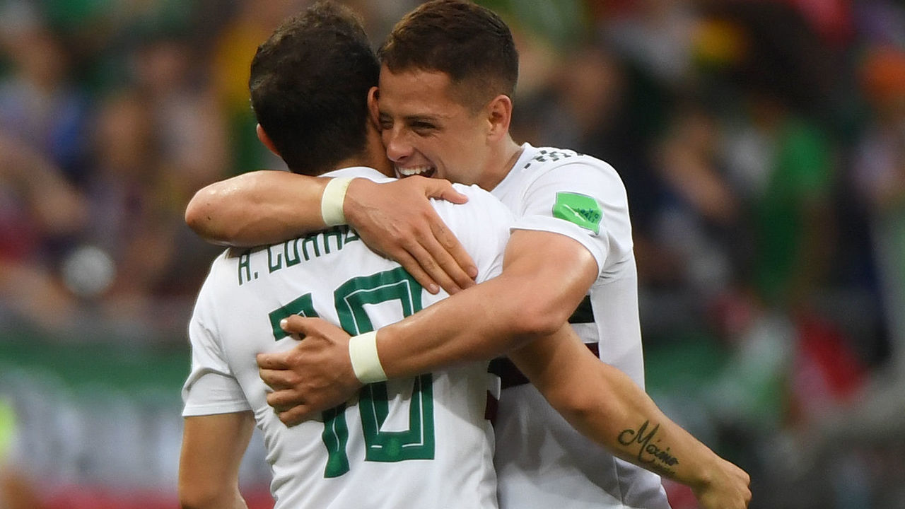 Mexico's forward Javier Hernandez (R) embraces Mexico's midfielder Giovani Dos Santos (L) after the final whistle of the Russia 2018 World Cup Group F football match between South Korea and Mexico at the Rostov Arena in Rostov-On-Don on June 23, 2018.