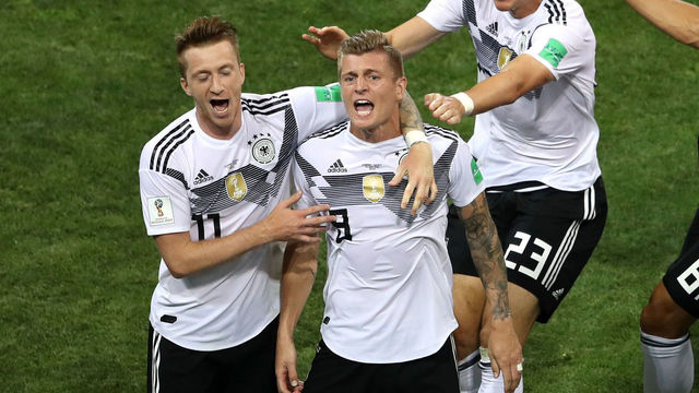 SOCHI, RUSSIA - JUNE 23: Toni Kroos of Germany celebrates with teammates Marco Reus (l) and Mario Gomez after scoring his sides winning goal during the 2018 FIFA World Cup Russia group F match between Germany and Sweden at Fisht Stadium on June 23, 2018 in Sochi, Russia.