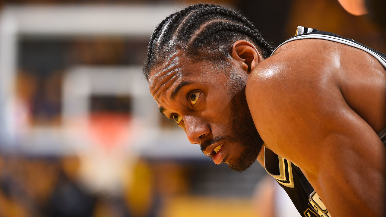 OAKLAND, CA - MAY 14: Kawhi Leonard #2 of the San Antonio Spurs looks on during the game against the Golden State Warriors in Game One of the Western Conference Finals of the 2017 NBA Playoffs on May 14, 2017 at ORACLE Arena in Oakland, California. NOTE TO USER: User expressly acknowledges and agrees that, by downloading and/or using this Photograph, user is consenting to the terms and conditions of the Getty Images License Agreement. Mandatory Copyright Notice: Copyright 2017 NBAE