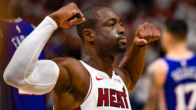 MIAMI, FL - APRIL 21: Dwyane Wade #3 of the Miami Heat flexes his biceps after scoring and getting fouled in the fourth quarter against the Philadelphia 76ers during Game Four of Round One of the 2018 NBA Playoffs at American Airlines Arena on April 21, 2018 in Miami, Florida.
